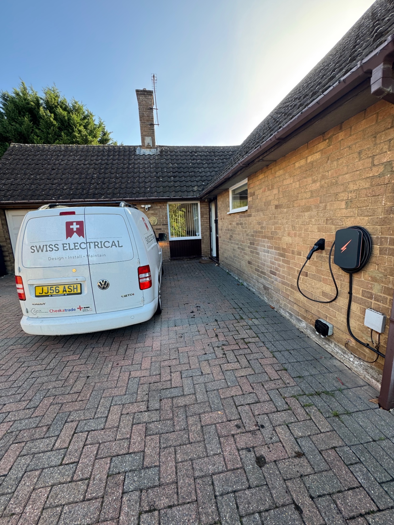 Swiss Electrical on the job — new charger on the driveway
