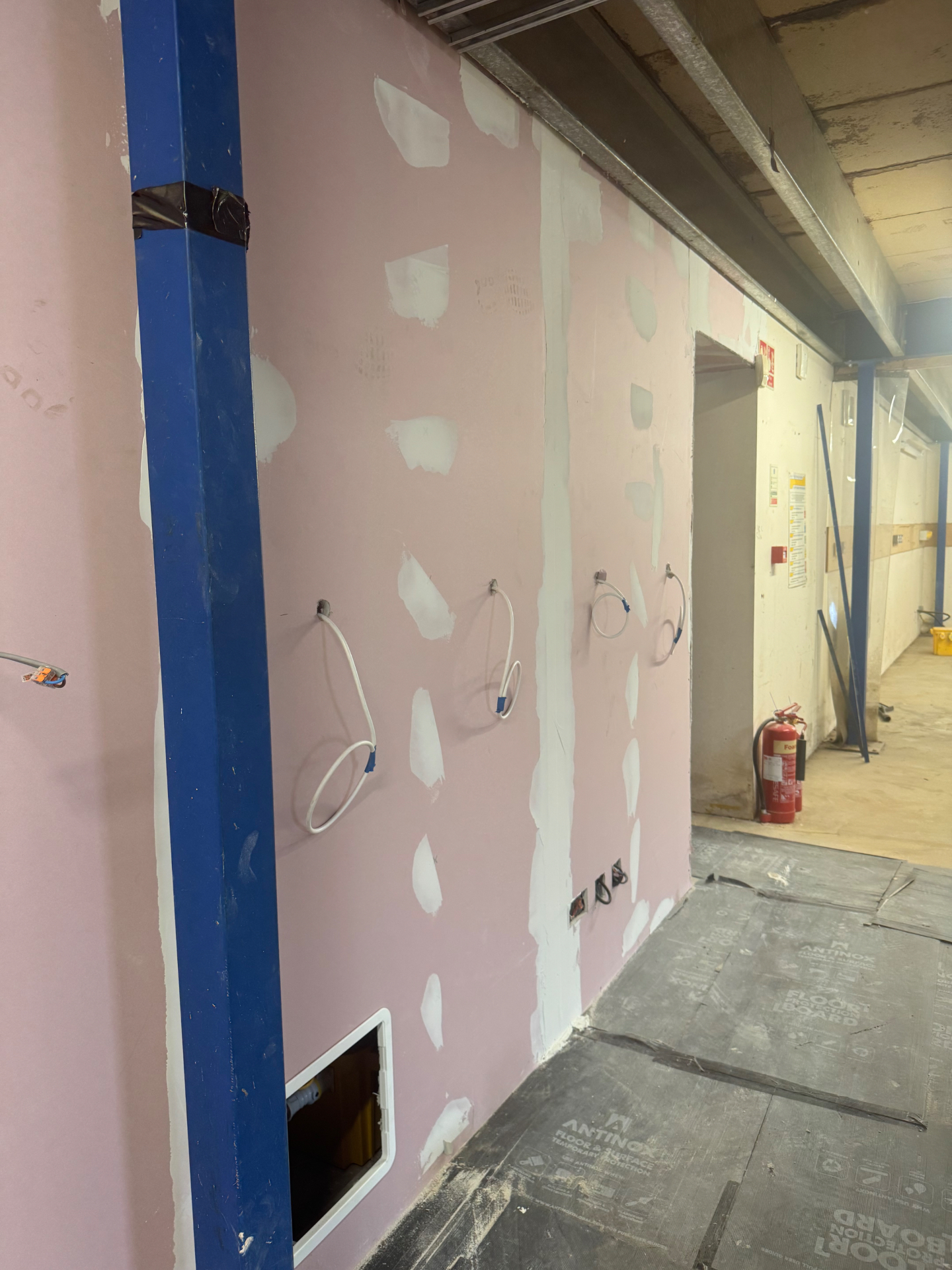 Swiss Electrical on the job — wiring a new partition wall